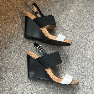Size 7 US 37 EU, black white with cork heel 4”. In over all good shape!